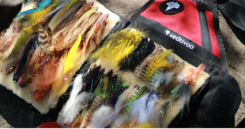 A bag full of different colored fly flies.