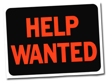 A sign that says help wanted on a white background.