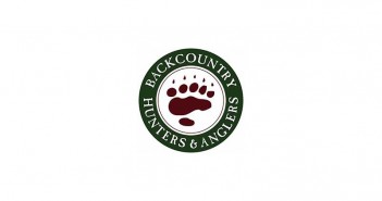 A logo with a bear's paw on it.