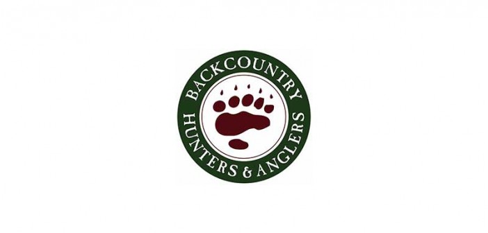 A logo with a bear's paw on it.