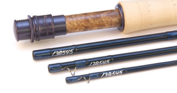 A fly rod with a wooden handle and a wooden handle.