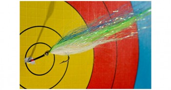 A target with a green, blue, and yellow arrow in it.