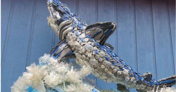 A sculpture of a shark made out of plastic bottles.