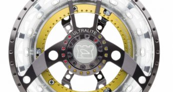 A fly reel on a white background.