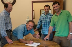 Orvis leaders signing the “Now or Neverglades” declaration.  From left: president Bill McLaughlin, CEO Perk Perkins, brand director Simon Perkins, product developer Charley Perkins.  Not pictured:  Dave Perkins, executive vice-chairman 