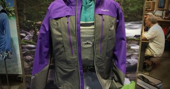 A purple and gray jacket on display in a store.