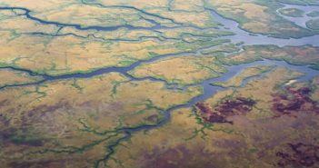 An aerial view of a river and land.
