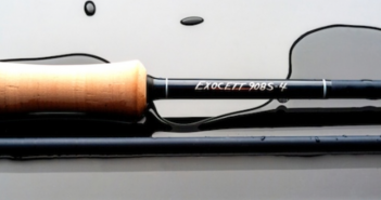A fly rod with a drop of water on it.
