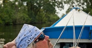 A man in a blue boat.