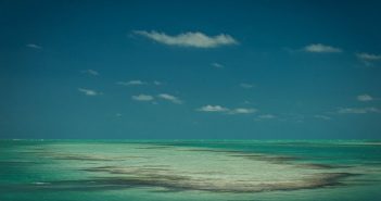 A small island in the middle of the ocean.