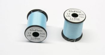 Two spools of blue thread on a white background.