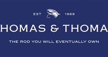 Thomas & thomas logo on a blue background.