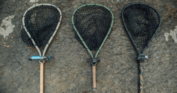 Three different types of fishing nets on the ground.