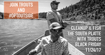 Two men in a canoe with the words join trouts and clean the south plate on black friday.