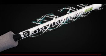 A video of a fishing rod with a black background.