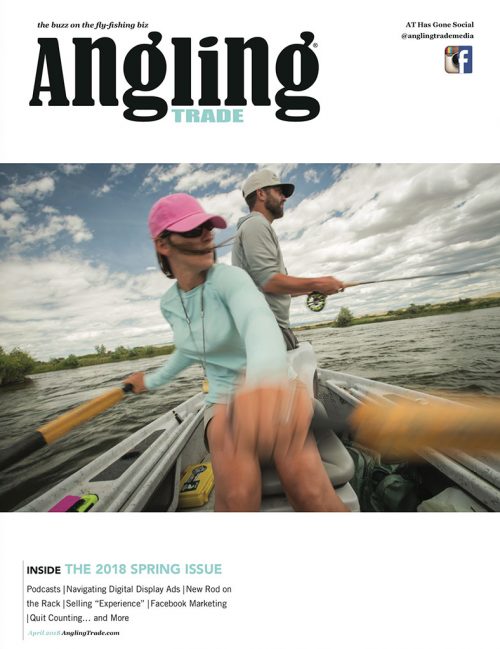 The cover of anangling magazine with two people in a canoe.