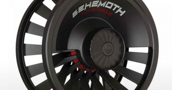 A black fly fishing reel with red and black rims.