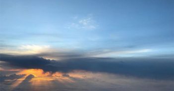 A sunset seen from an airplane window.
