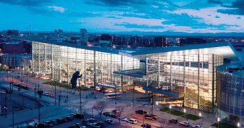 An aerial view of a large building at dusk.