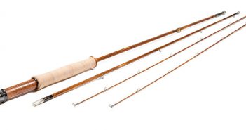 A pair of wooden fly rods on a white background.