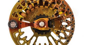 A fly reel on a white background.