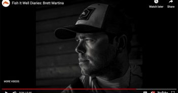 A man in a hat is wearing a cap.