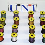 A group of spools of different colors of thread.