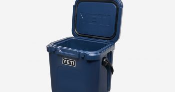 A yeti cooler with a lid and a handle.
