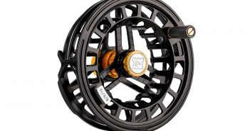 A black and yellow fly reel on a white background.