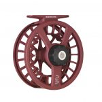 A fly reel in maroon with a black handle.