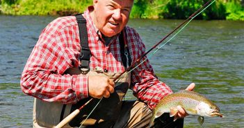 A man holding a fish.
