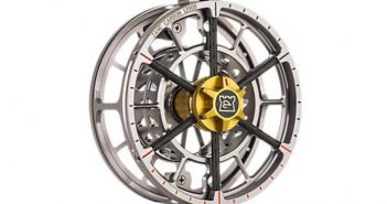 A fly reel on a white background.