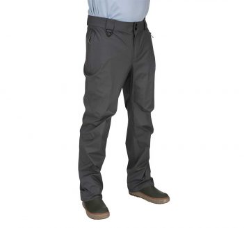 A man is standing with his hands in his pockets.