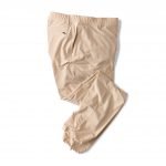 A pair of beige pants on a white background.