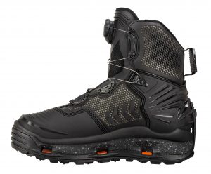 A pair of black snow boots with orange soles.