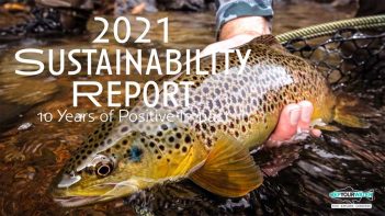 A person holding a brown trout with the words 2021 sustainability report.