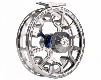 A silver and blue fly reel on a white background.