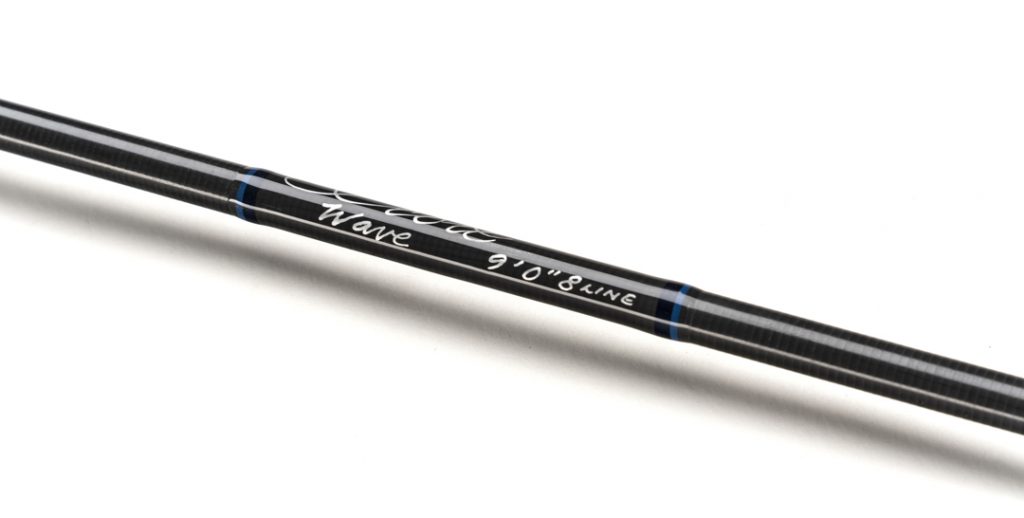 A black fishing rod with blue writing on it.