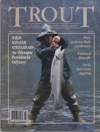 The cover of trout magazine with a man holding a fish.