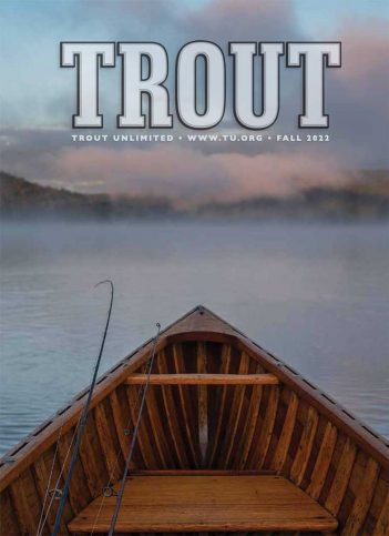 The cover of trout magazine with a boat in the background.