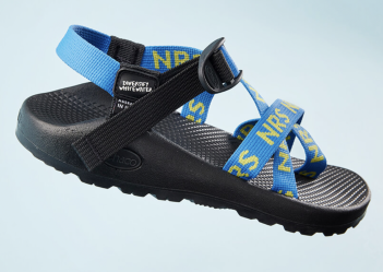 A black and blue sandal with blue straps.