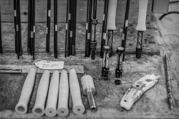 A black and white photo of various tools on a table.
