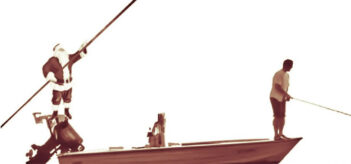 Santa claus fishing in a boat.