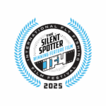 A circular badge reads "The Silent Spotter Winning Feature Film IF4 2025" with blue laurel leaves and "International Fly Fishing Film Festival.